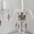 Marketa3-1001, an elegant coloured bohemian crystal table lamp with 3 arms. It has pastel pink lead crystals. Nickel Finish.