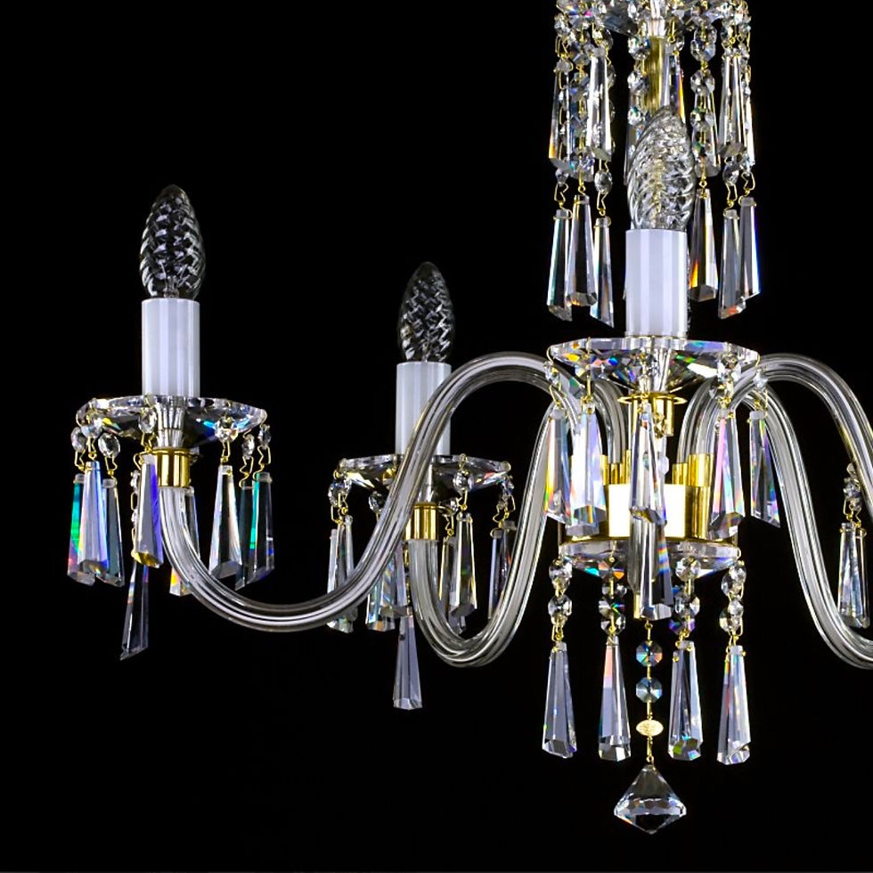 Thumbnail: Ingeborg is a modern chandelier with rimmed glass arms, opaque glass candles, ornate crystal bobeches & 30% PbO crystal spear