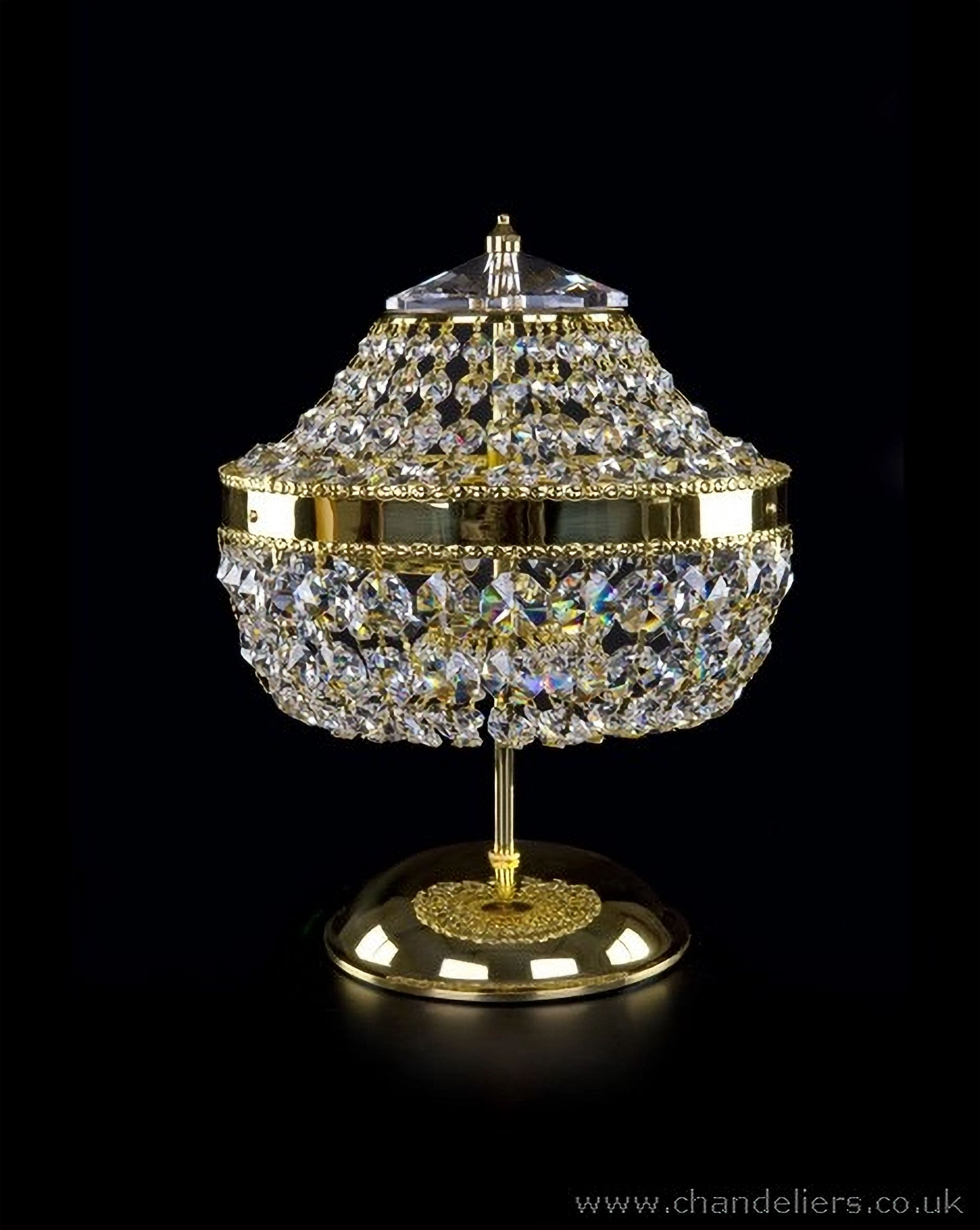 A Bohemian crystal table lamp adorned with 30% PbO crystal chains that reflect light beautifully.