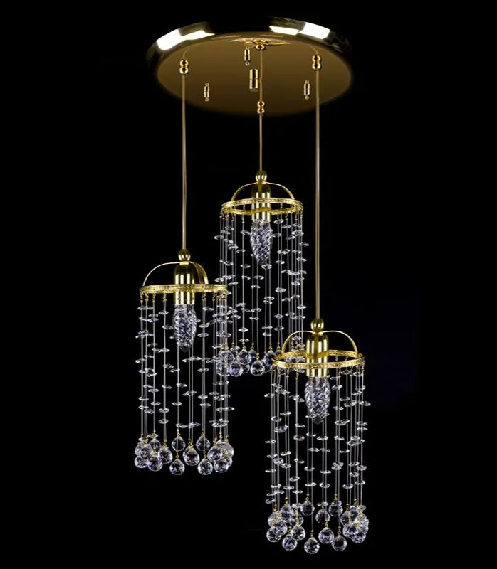 Modern basket chandelier, with a polished brass metal plate, is adorned with 30% PbO crystals & balls.