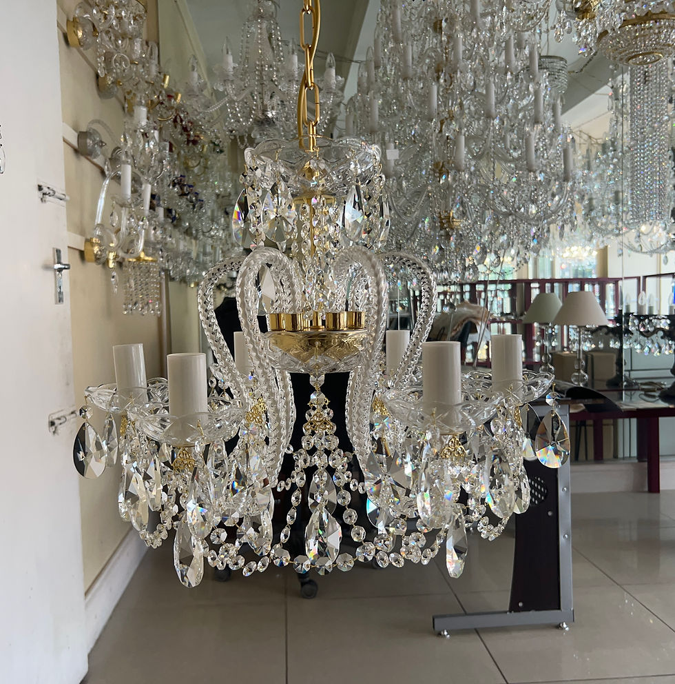 Thumbnail: Celine chandelier an exquisite design with 24% PbO bohemian crystal, this unique piece has curled arms & oval crystals.