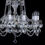 Thumbnail: Donatela-10 is a 30% lead classical chandelier with rope-twist glass arms, ornate glass bobeches & opaque glass candles.