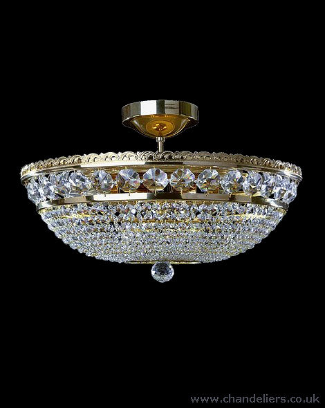 The KV8 is a stunning basket chandelier, elegantly adorned with 30% lead crystals that enhance its brilliance. Gold Finish.