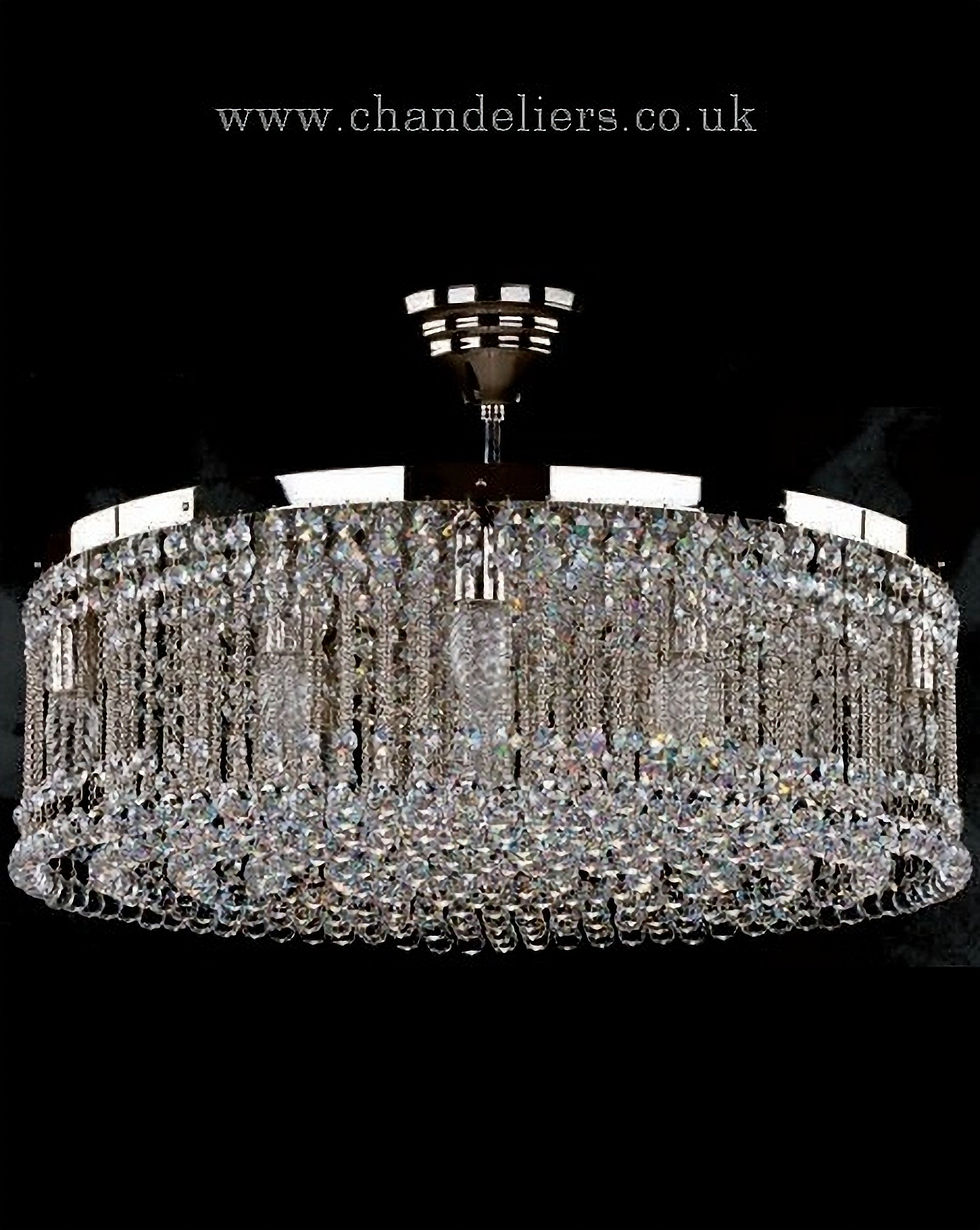 Persida is a modern crystal chandelier with a ornate polished nickel metal frame, with Bohemian lead crystal chains & balls.
