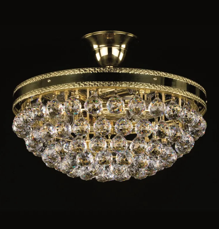 The Leila chandelier is adorned with 30% lead crystal balls that shimmer brilliantly.