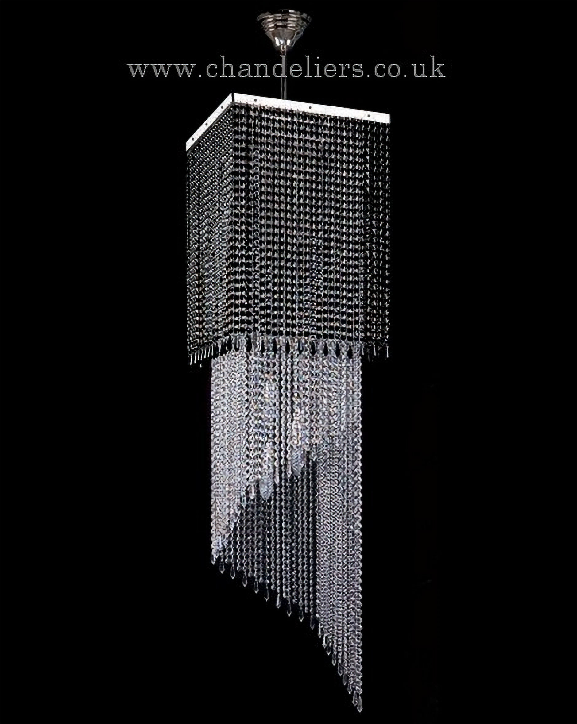 Ambra is a striking chandelier, adorned with exquisite 30% PbO crystal chains in a stunning mix of black and clear crystals.