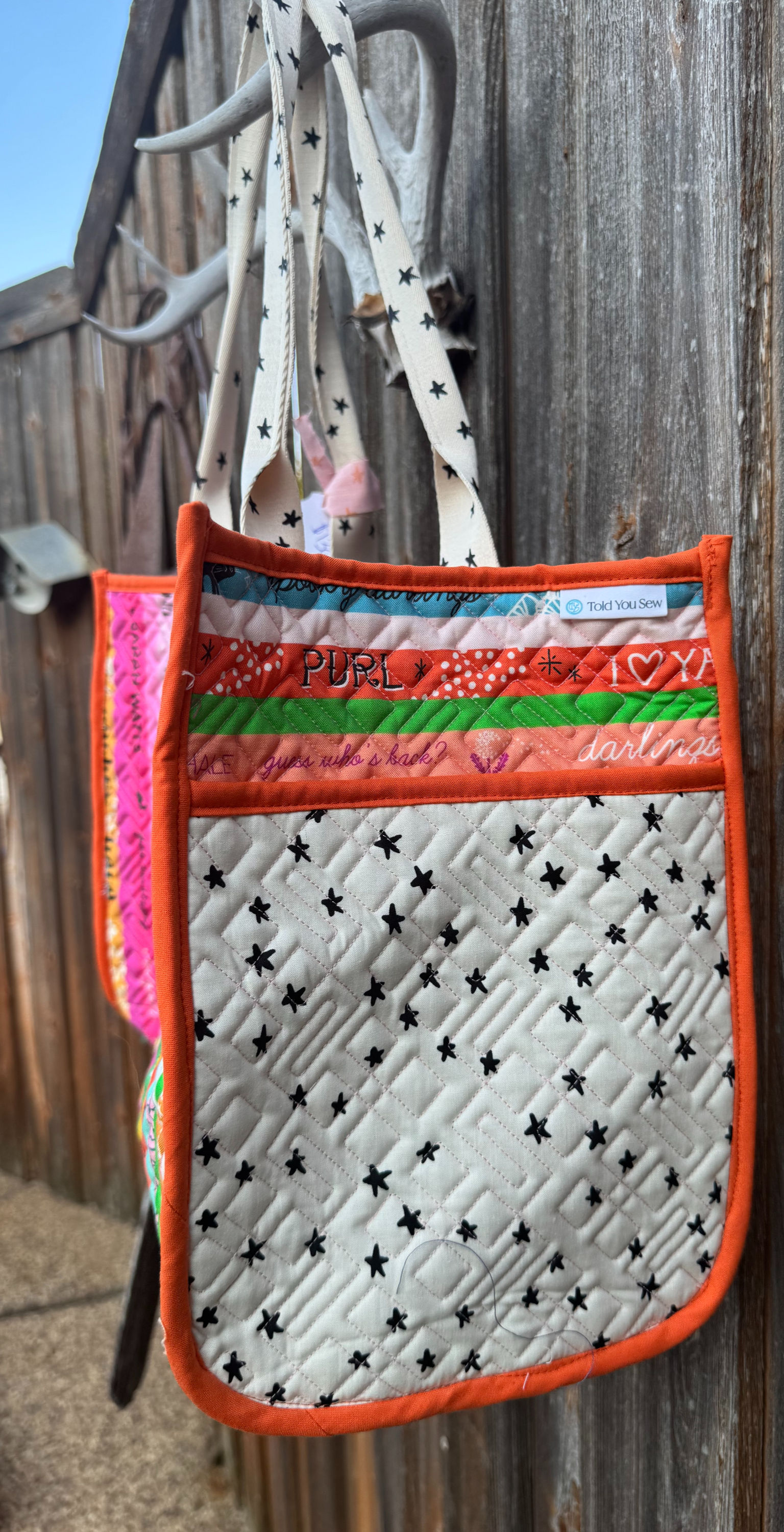 multicolor bag with starry strap