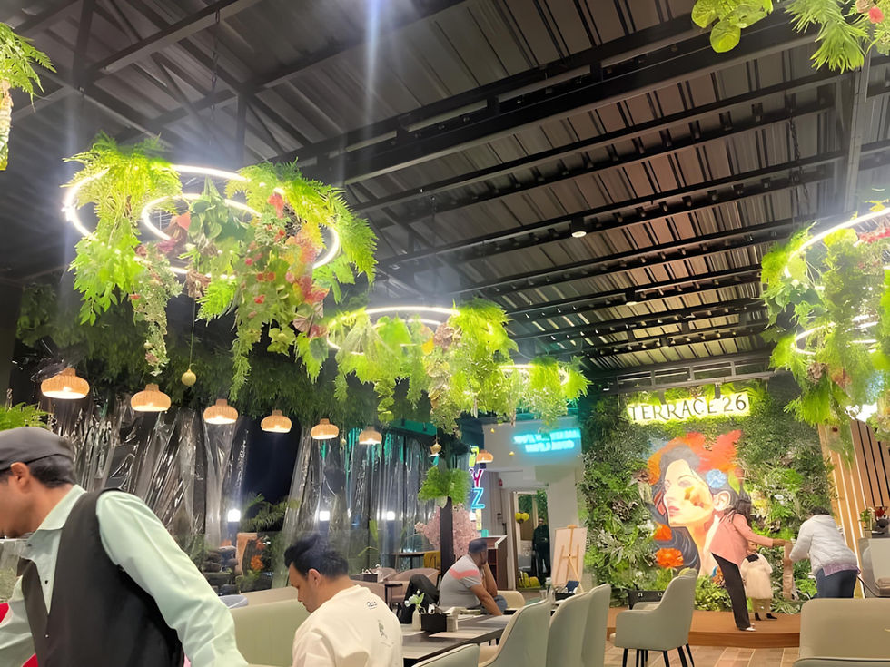 Biophilic rooftop restaurant design with hanging plants and ambient ceiling lights