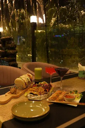 Biophilic hospitality design with vertical garden wall in rooftop restaurant