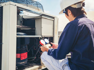 HVAC Technician Inspecting a Unit