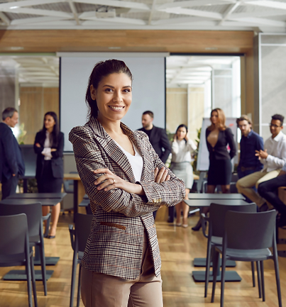 Confident professional woman standing with arms crossed in front of a team in a modern meeting room, symbolizing strong leadership and successful talent acquisition. Reflects Intercon Recruitment’s commitment to quality placements in Durban, Umhlanga, Ballito, and across KwaZulu-Natal.