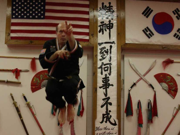 Self defense classes near me - adult martial arts instructor jumping
