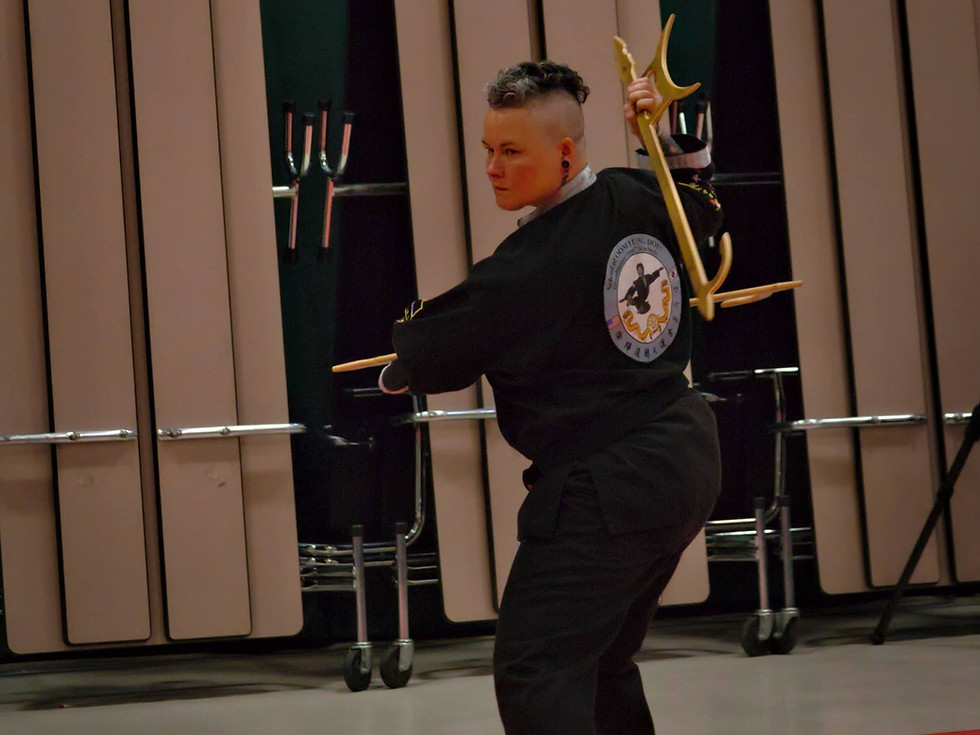 martial arts weapons - adult martial arts lessons instructor with marital arts weapons
