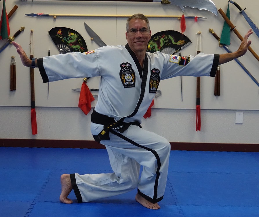 Martial arts for Seniors - senior martial arts instructor going through lessons