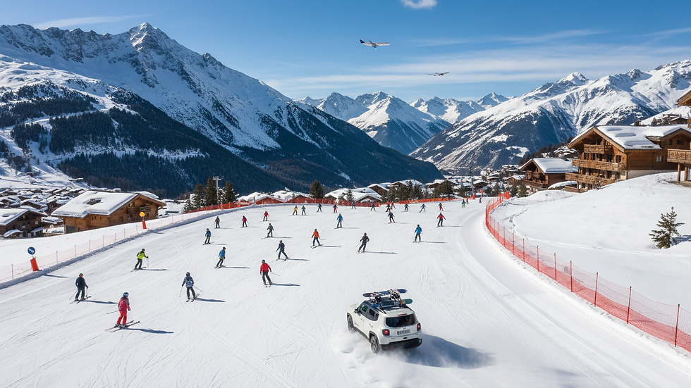 High angle view of a ski slope with safety barriers and helmeted skiers