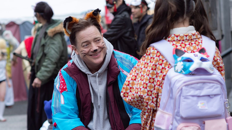 Man in fox costume with face paint smiles at a girl wearing patterned outfit and backpack with fox mask. Colorful crowd in the background.