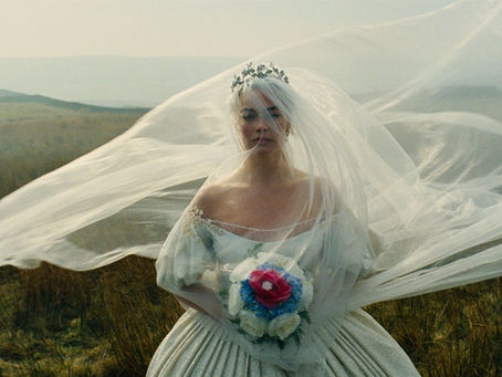 Bride in white dress with floral bouquet and flowing veil, standing in a misty field. A serene and dreamy atmosphere pervades the scene.