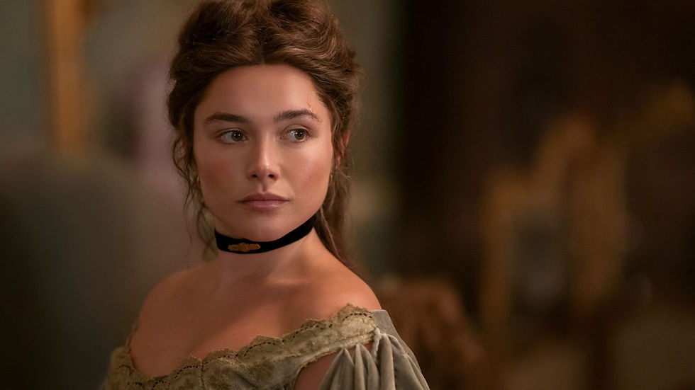 Young woman in an off-shoulder vintage dress and black choker, gazing left in a softly lit, warm-toned room, thoughtful.