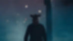 Person in a pig mask walks through foggy, dimly lit street at night. Silhouette against blue and purple haze, creating a mysterious mood.