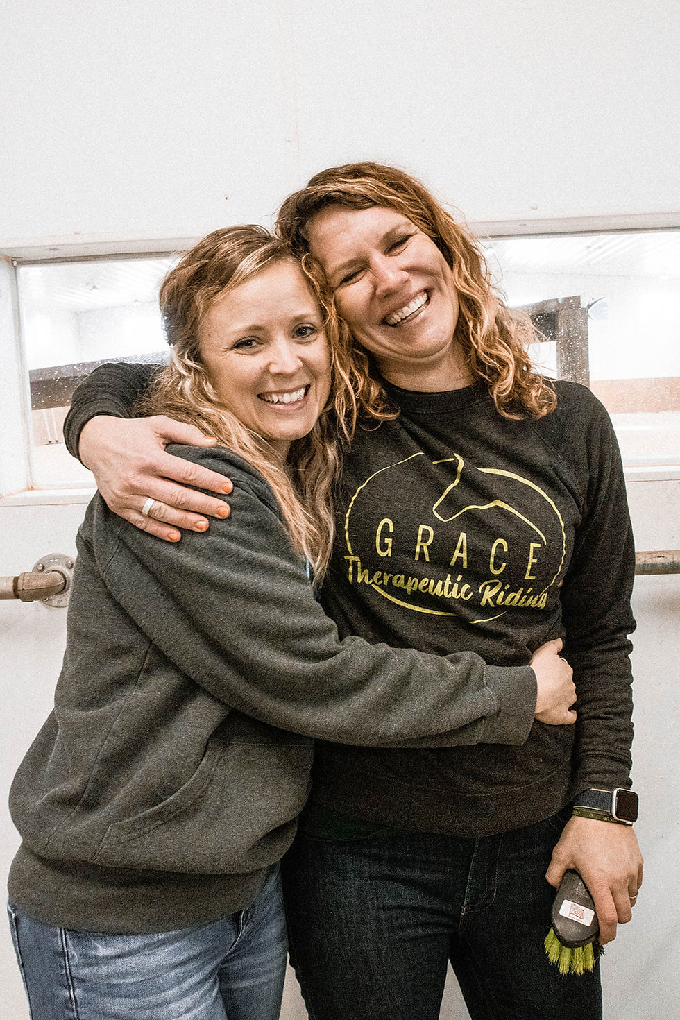 Ashley and Allison pose while getting horses ready for sessions