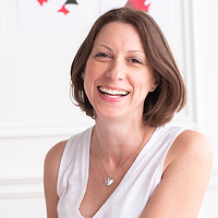 Woman in white shirt smiling
