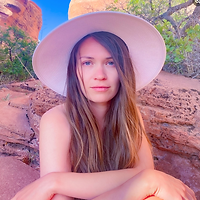 Woman in a hat giving testimony