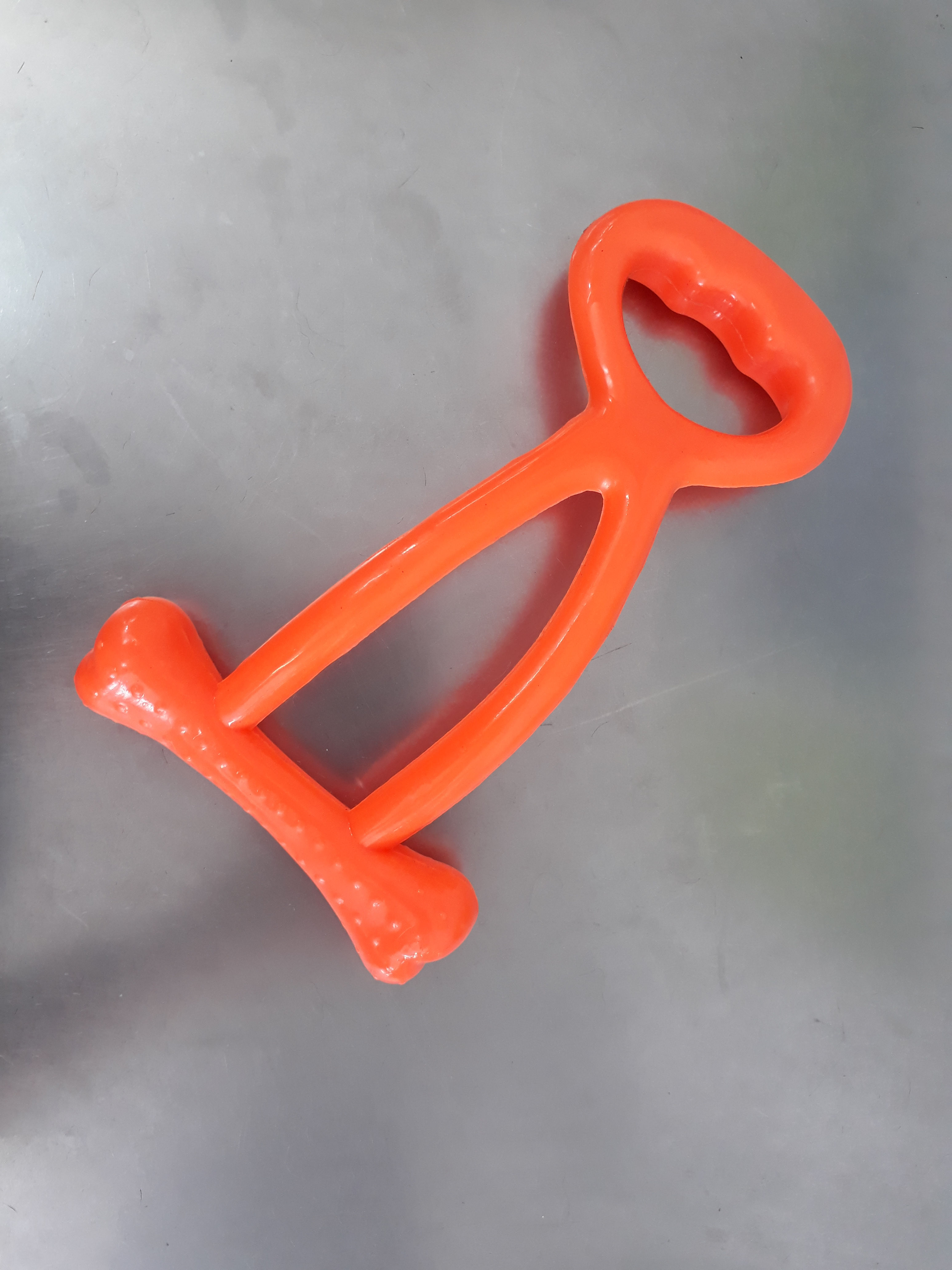 Juguete mordedor de plástico naranja