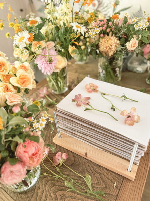 flower press surrounded with gorgeous flowers