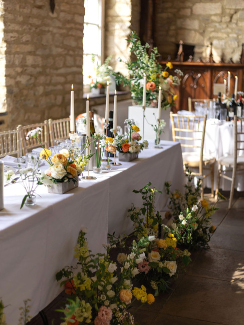 top table flowers in a vibrant, yellow and orange colour palette