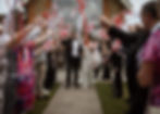wedding guest waving ribbon wands around the bride and groom instead of throwing confetti