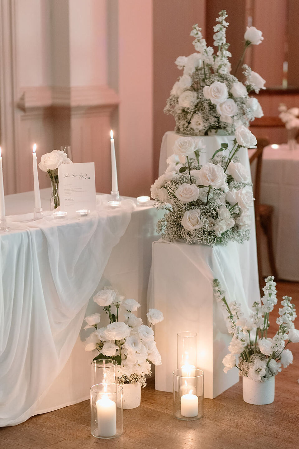 RoRomantic reception styling at a Drayton Court Hotel wedding with white roses and candles
