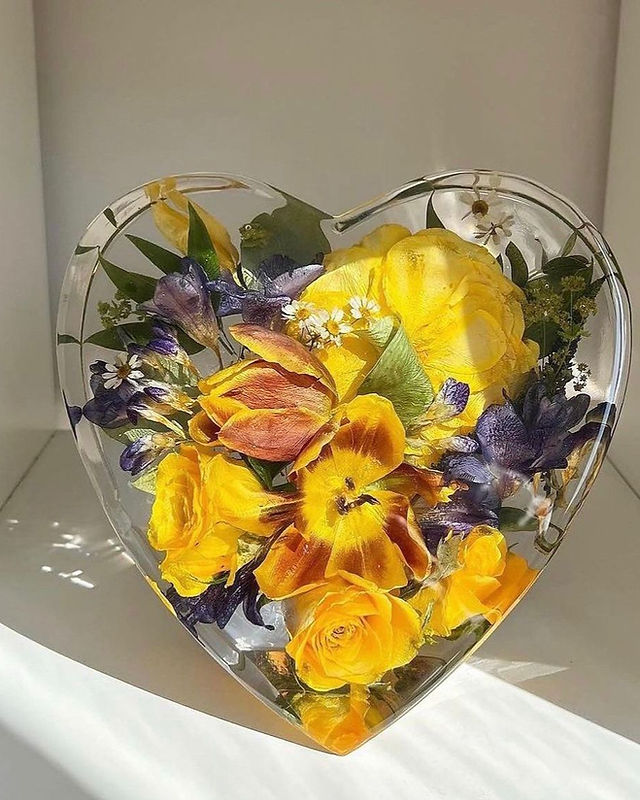 yellow and purple flowers preserved in resin