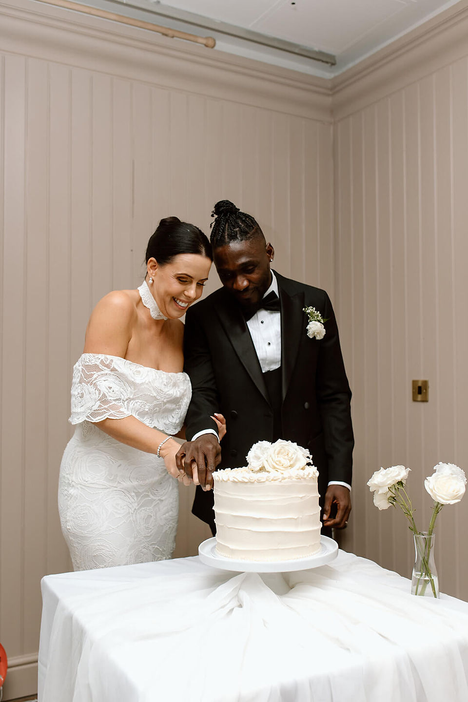 Bride and groom cutting their cake