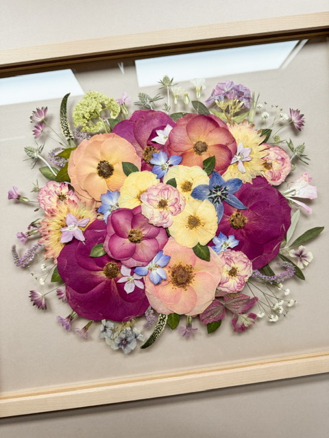 colourful bouquet pressed into floral frame