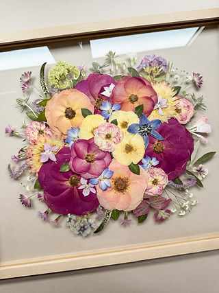 colourful bouquet pressed into floral frame