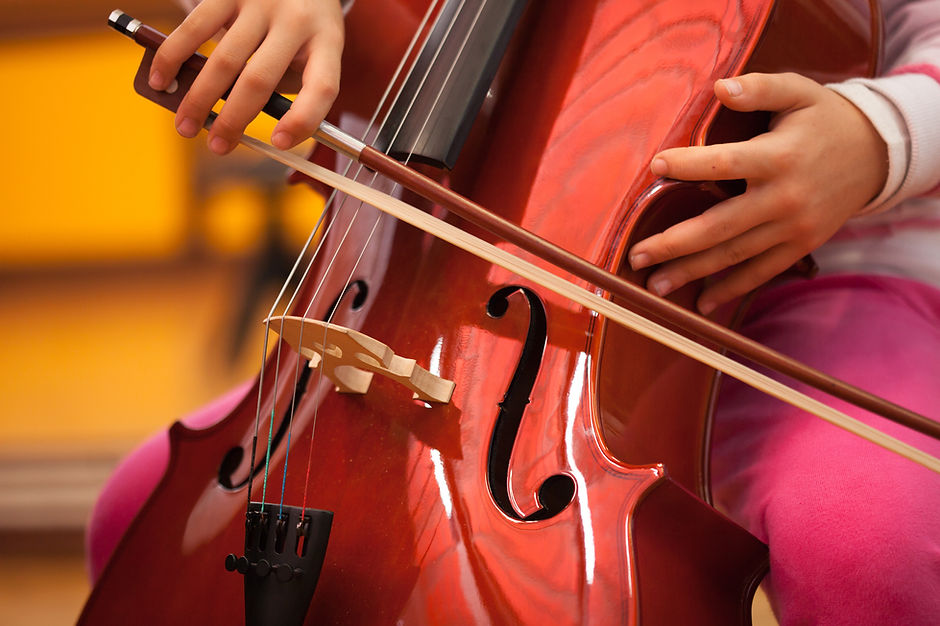 Detail of a child playing the cello.jpg