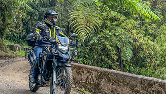 A rider in the cloudforest during a motorcycle day trip from Medellin