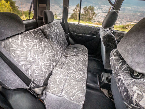 Rear seats of Mitsubishi Pajero iO 4x4 SUV with patterned fabric, part of our Medellin car rental fleet.