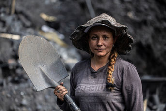 Woman emerald miner on moto adventure Colombia near Medellín.