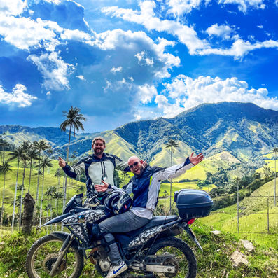 Riders posing with motorcycles in San Félix Wax Palm Forest on Coffee Region Colombia motorcycle tour.
