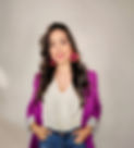Business owner standing with her hands in her front pocket.