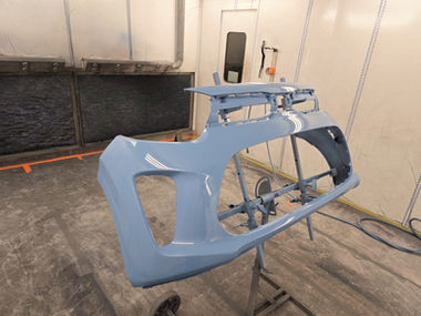 Newly sprayed blue car bumper