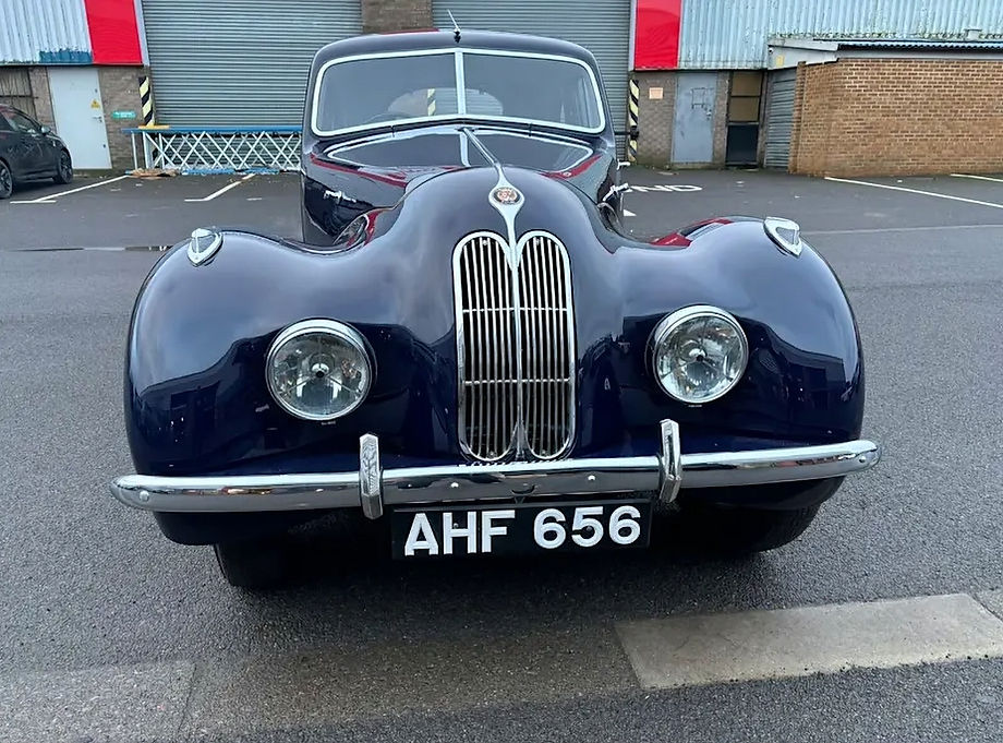 Black classic car on a driveway