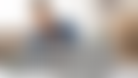 Image of a male, brown skin sitting at a work desk with his head in his hand and eyes closed - text overlay shows the words - Why Your Team Stops Listening When You Say 'I Think Maybe We Should...'   