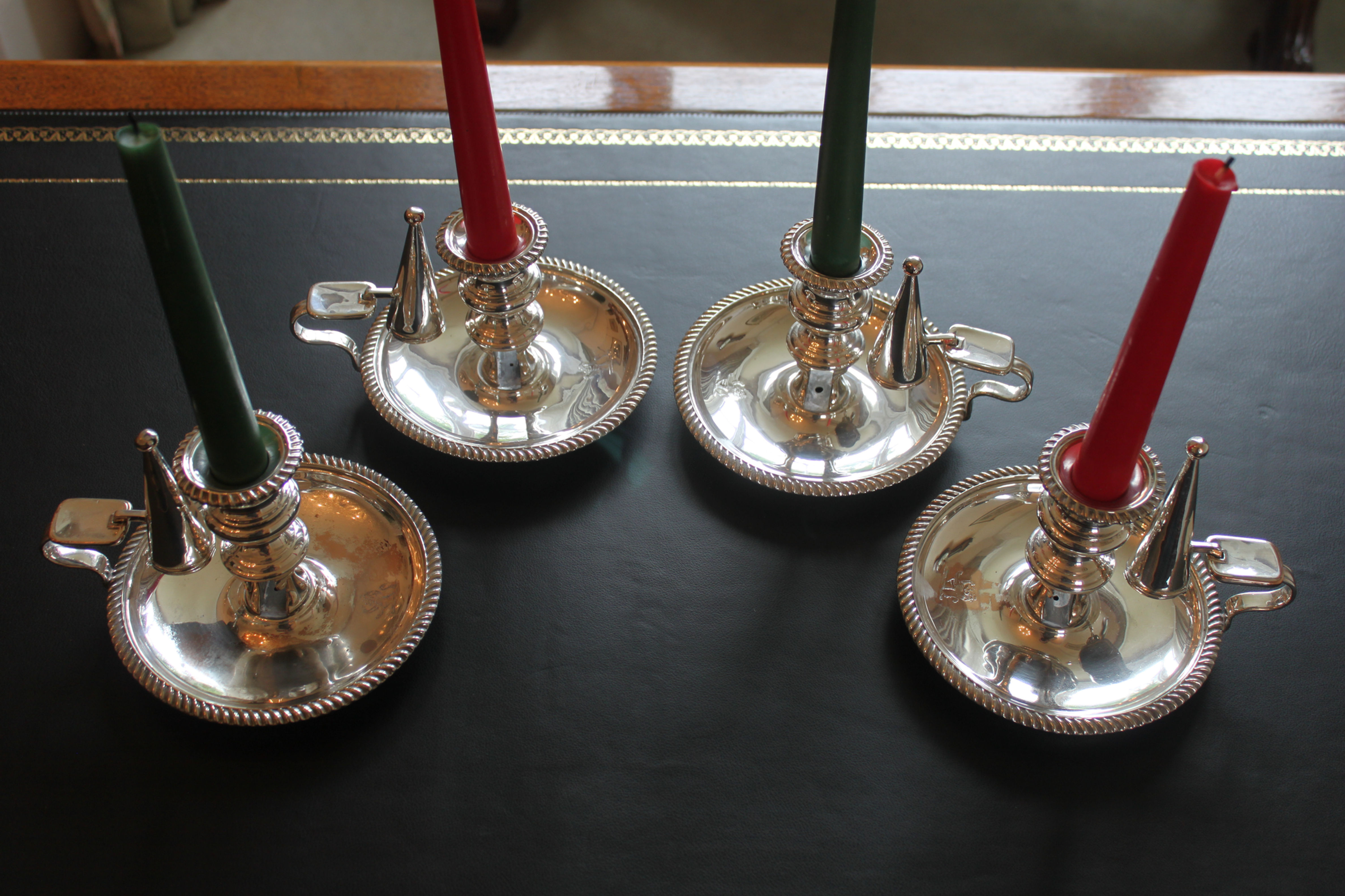 A rare set of four early 19th century silver plated chamber sticks