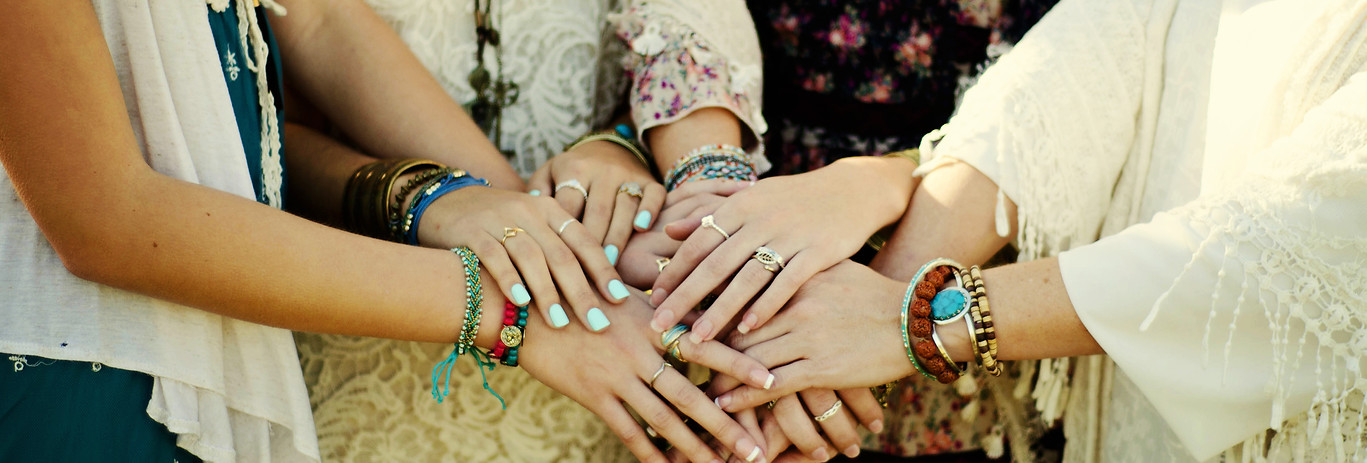 four boho style women from behind outdoors.jpg