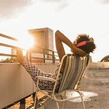 Woman Sitting on Roof