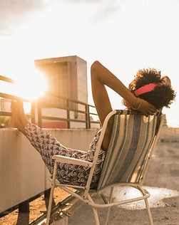 Woman relaxing at sunset