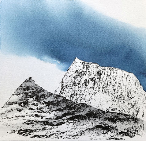 Mountain tops with blue sky above