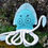 Thumbnail: A bright blue jelly fish design horse toy with rope tentacles and a grumpy face